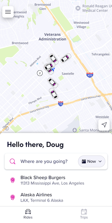 the home screen map in the lyft app with car icons and a text input bar to enter your destination
