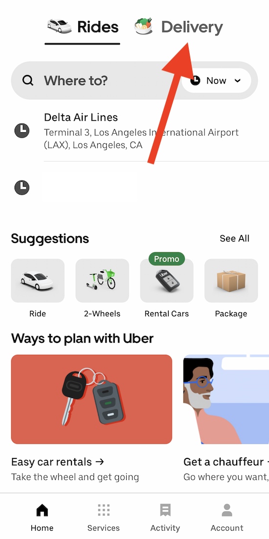 screen in the uber app with an arrow pointing to the delivery option